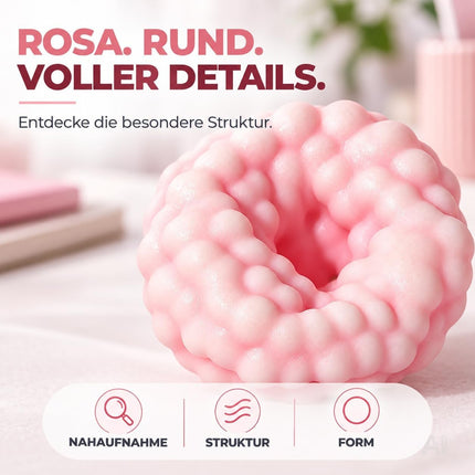 Runder rosa Knetball mit fühlbaren Oberflächendetails
