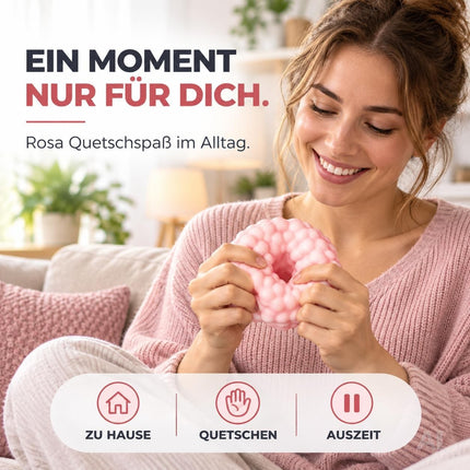Rosa Antistressball beim Kneten zu Hause